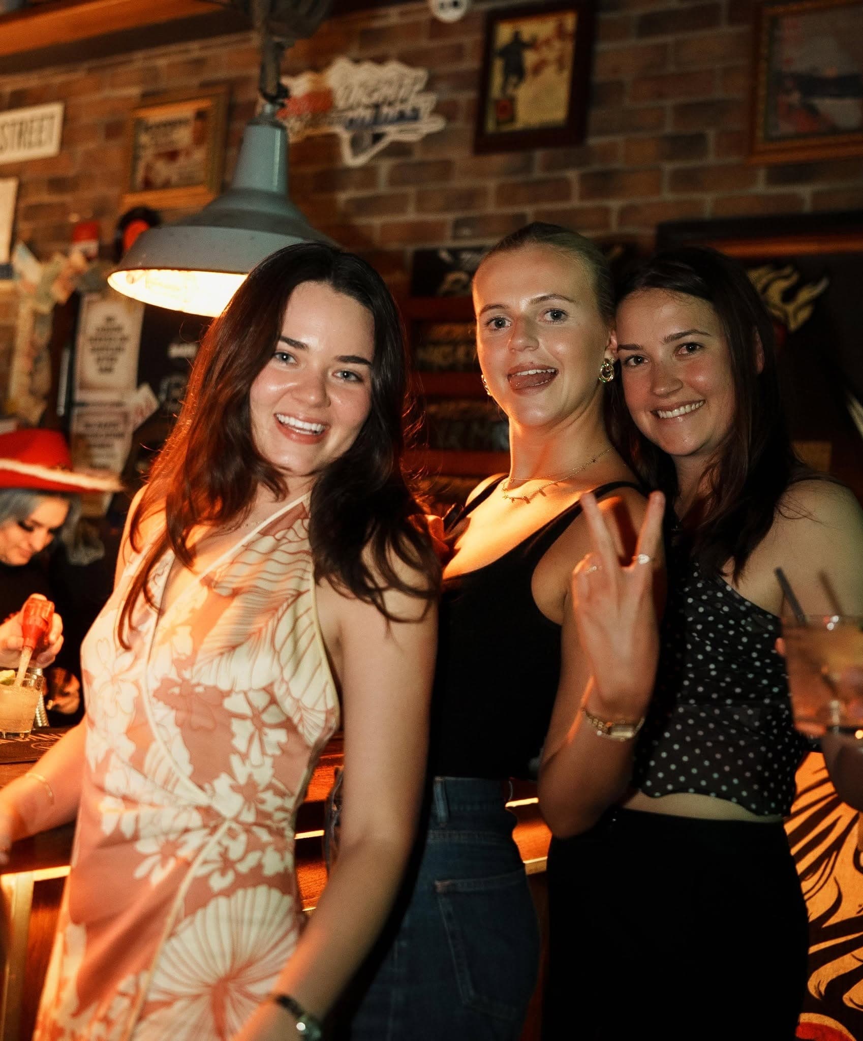 Friends posing at the bar